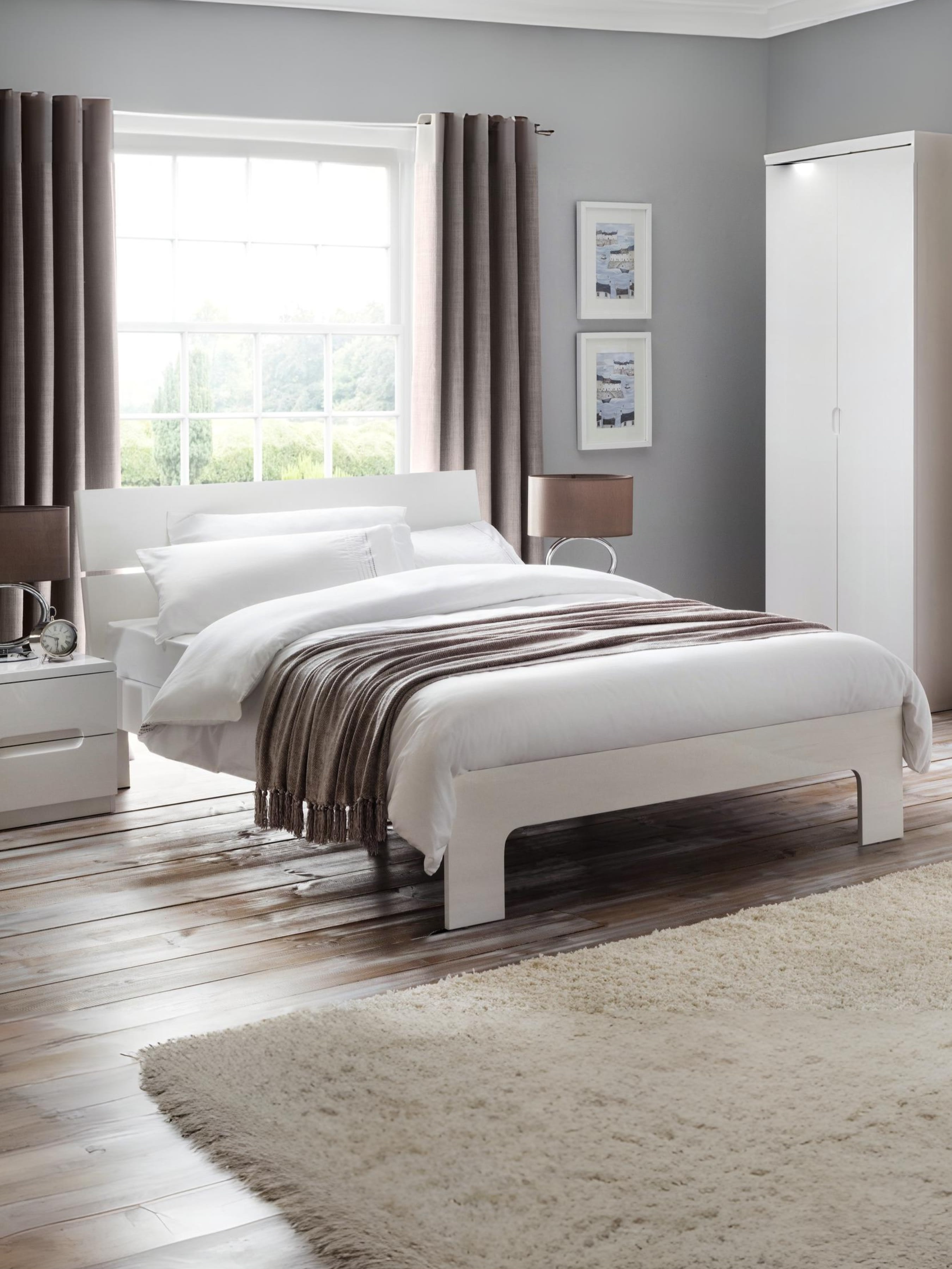 Julian Bowen Manhattan bed in white high gloss, in a bedroom with a rug