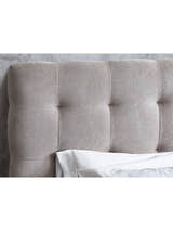Odette bed: buttoned panels of the light taupe headboard, close up