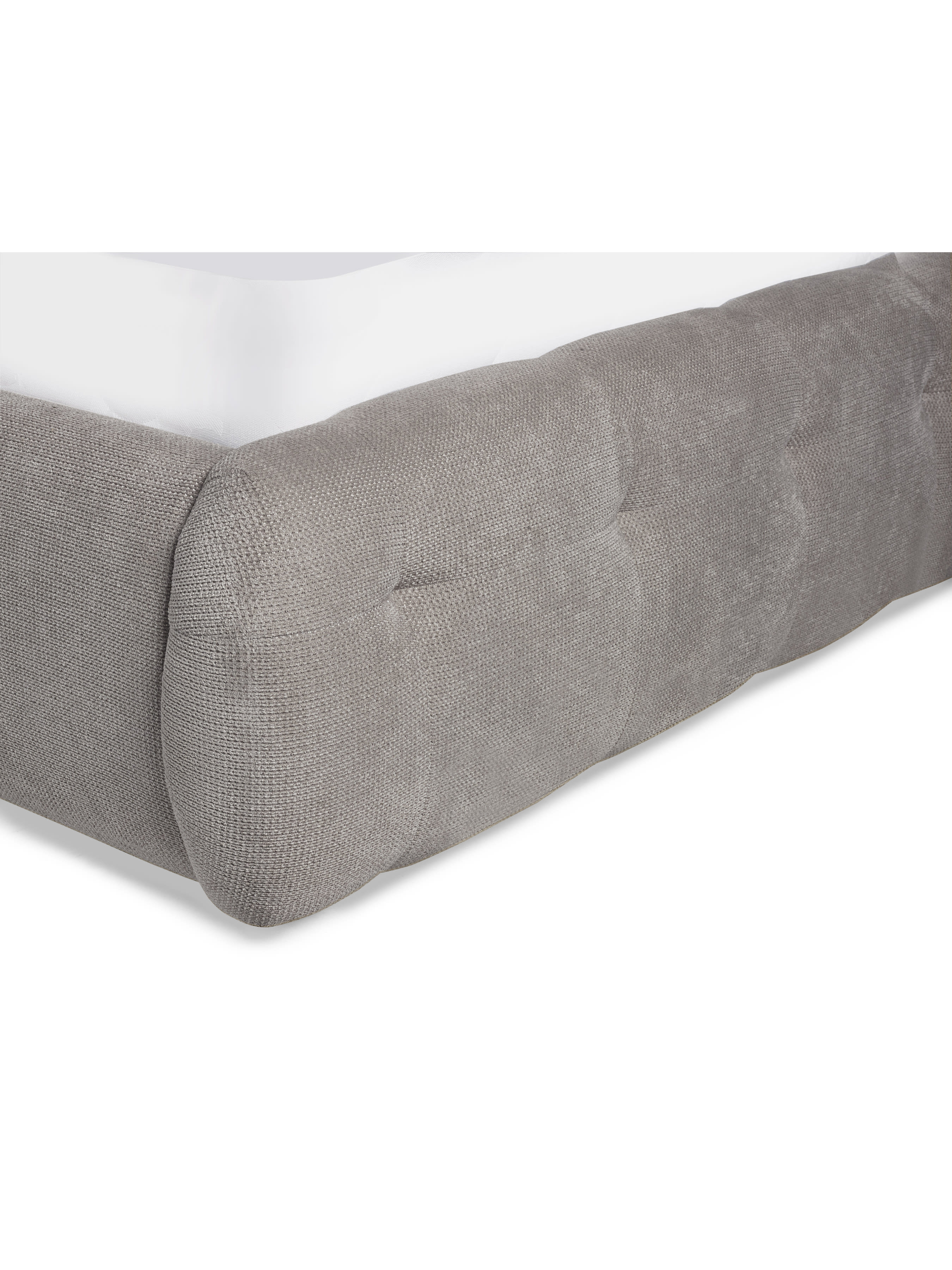 Odette bed: rounded corner of the light taupe footboard, close up