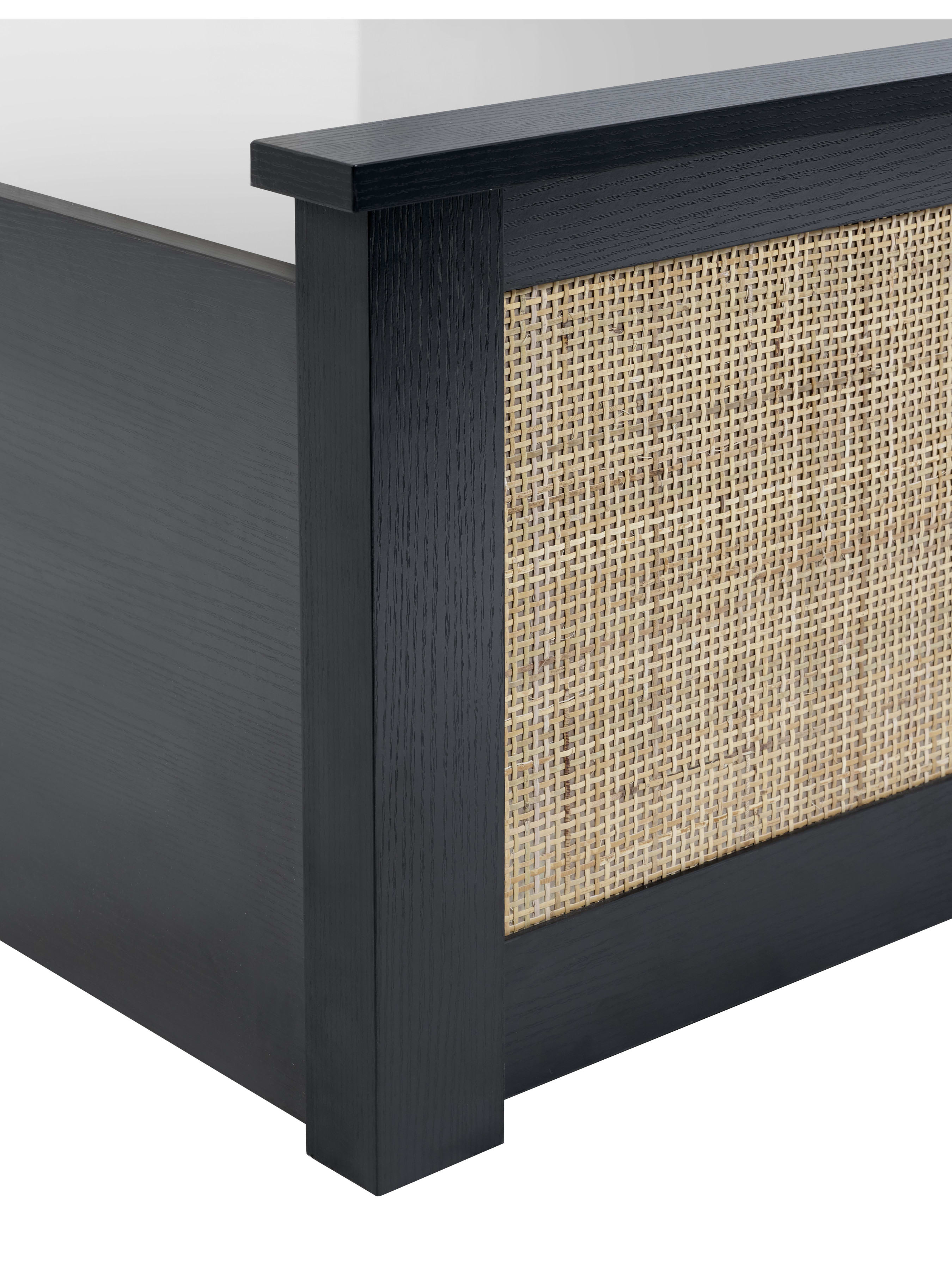 Padstow ottoman bed: corner of the black frame and rattan panel, close up