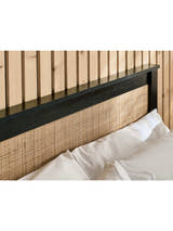 Padstow ottoman bed: woven rattan headboard panel in a black frame, close up