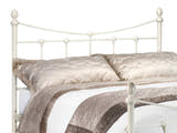 Julian Bowen Rebecca stone white metal headboard with a curved top rail and finials, close up