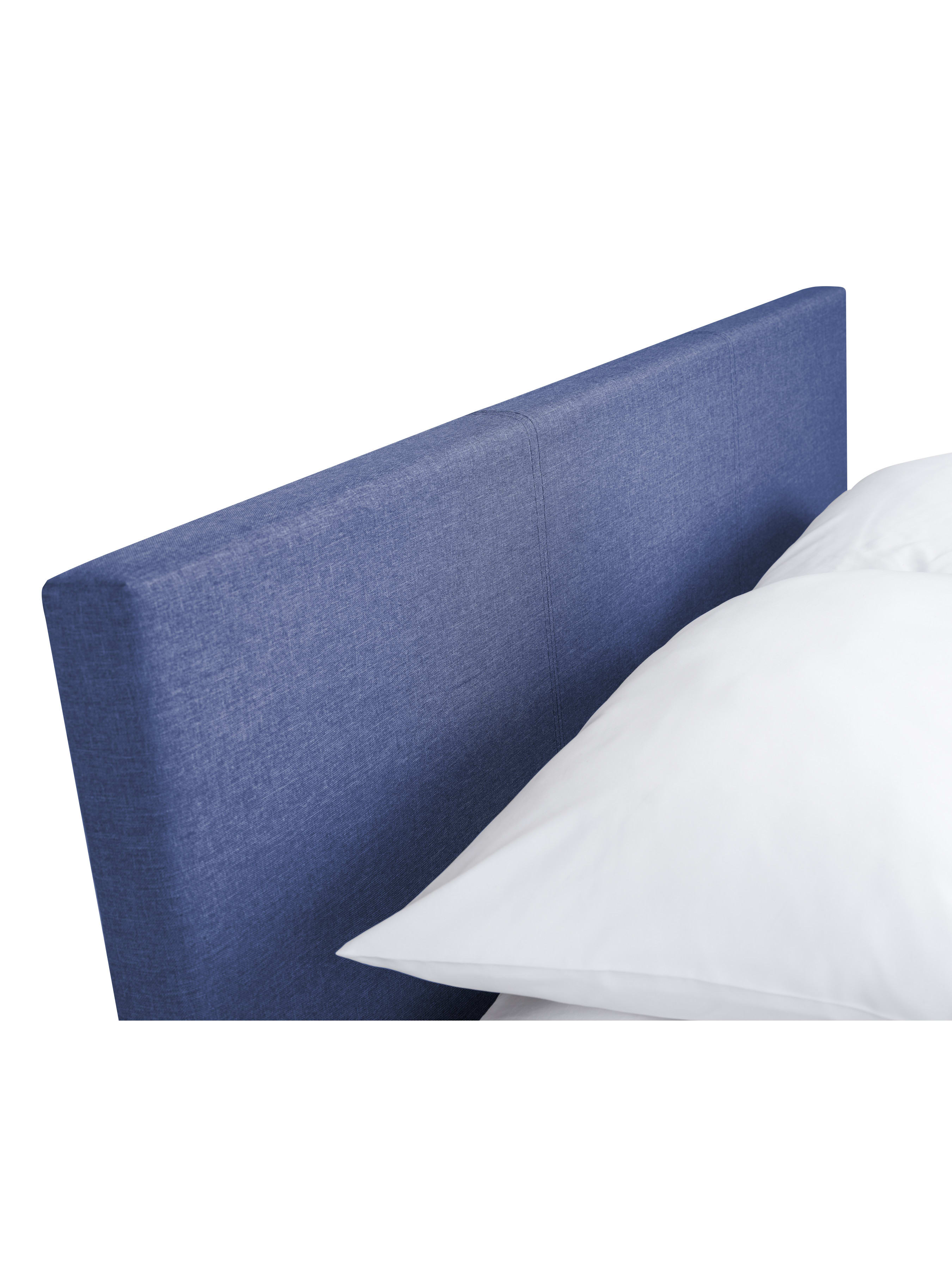 Rialto ottoman bed: the blue linen padded headboard with a pillow, close up