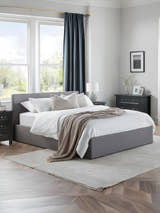 Julian Bowen Rialto ottoman bed in grey linen, made up in a bright bedroom