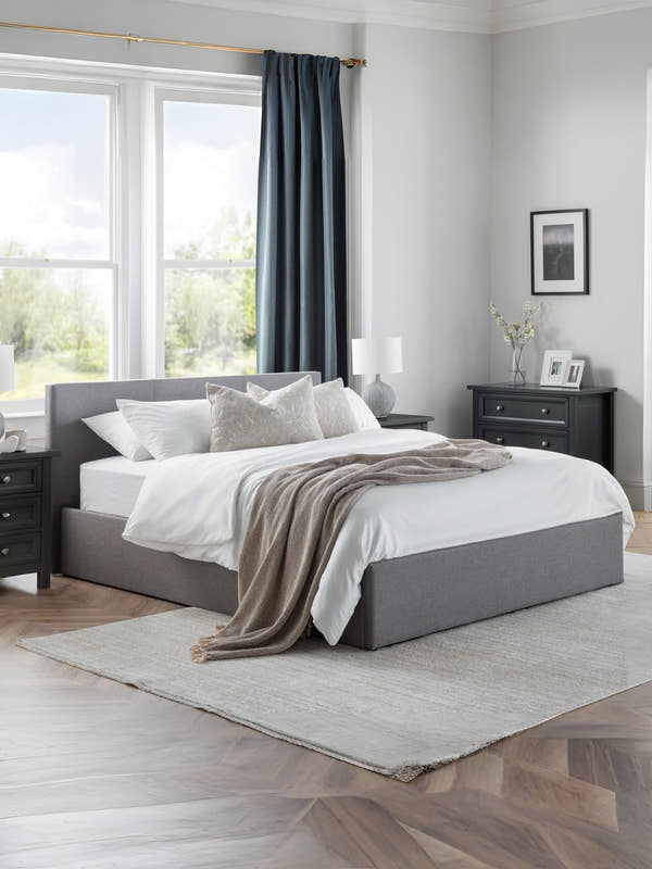 Julian Bowen Rialto ottoman bed in grey linen, made up in a bright bedroom