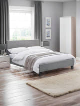 Julian Bowen Rialto upholstered bed in grey linen, in a bright bedroom with a wooden floor