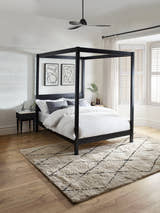Julian Bowen Roxanne black canopy bed, in a bedroom