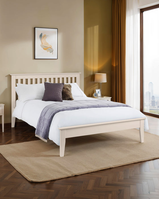 Julian Bowen Salerno shaker bed in ivory, in a bedroom with a herringbone floor