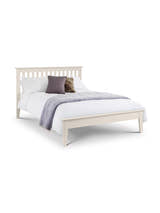 Julian Bowen Salerno ivory shaker bed made up with a grey throw, on a white background