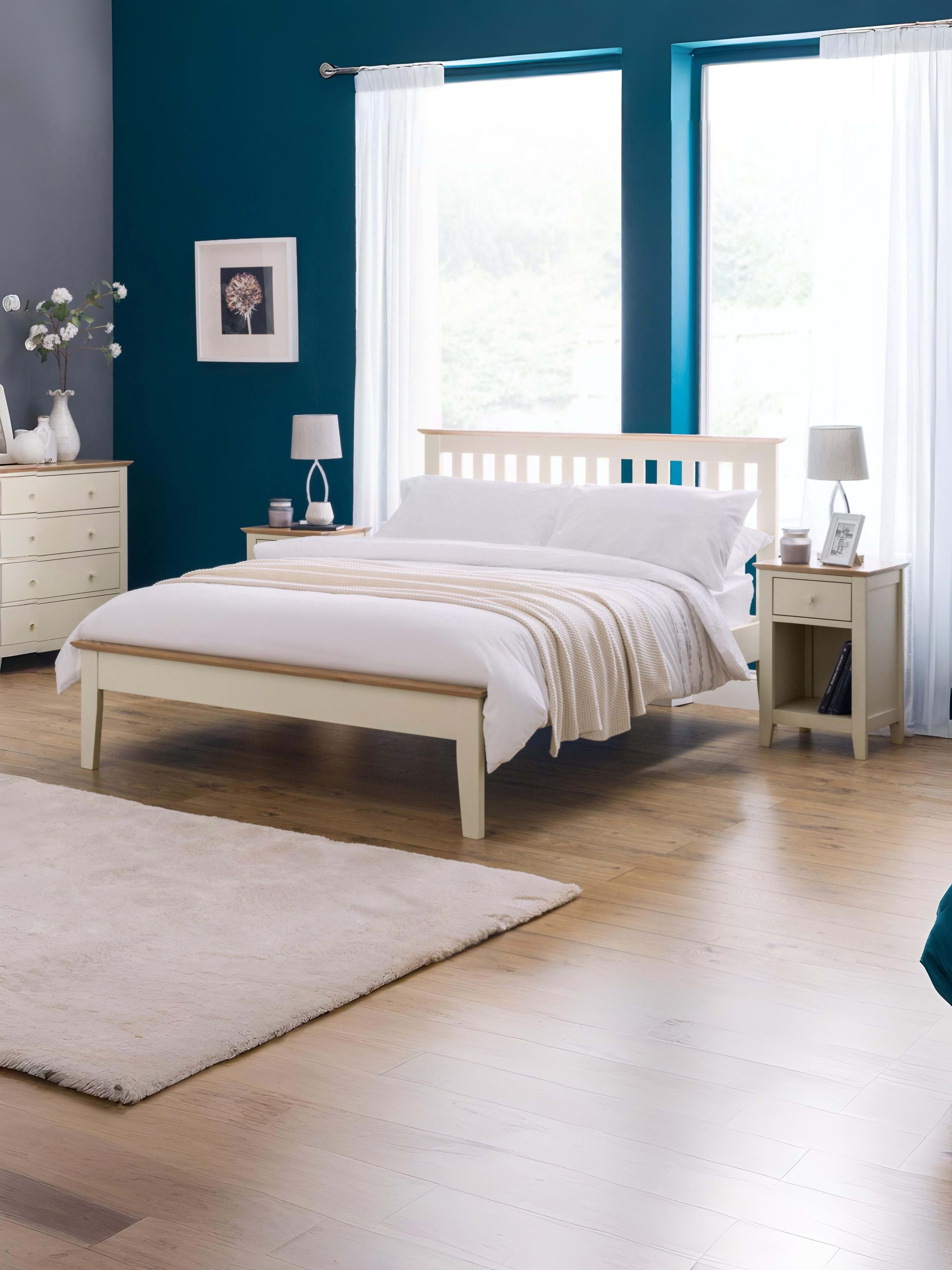 Julian Bowen Salerno shaker bed in ivory with oak cappings, in a bedroom with a blue wall
