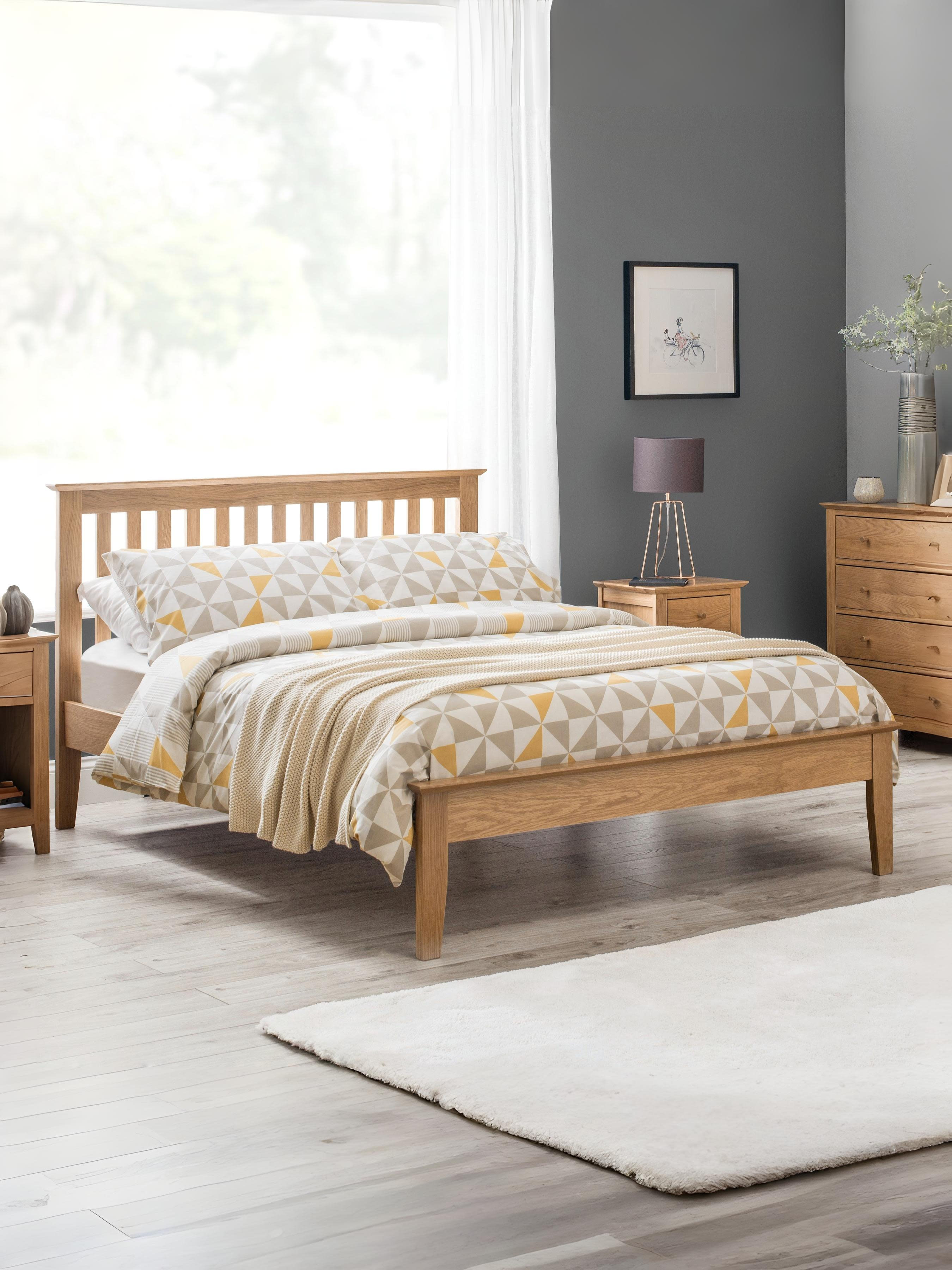 Julian Bowen Salerno shaker bed in natural oak, in a bedroom with a grey wall
