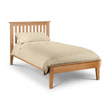 Julian Bowen Salerno natural oak shaker bed with check bedding, on a white background