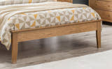 Julian Bowen Salerno natural oak footend and tapered leg, close up