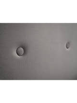 Shoreditch ottoman bed: two buttons on the slate grey headboard, close up