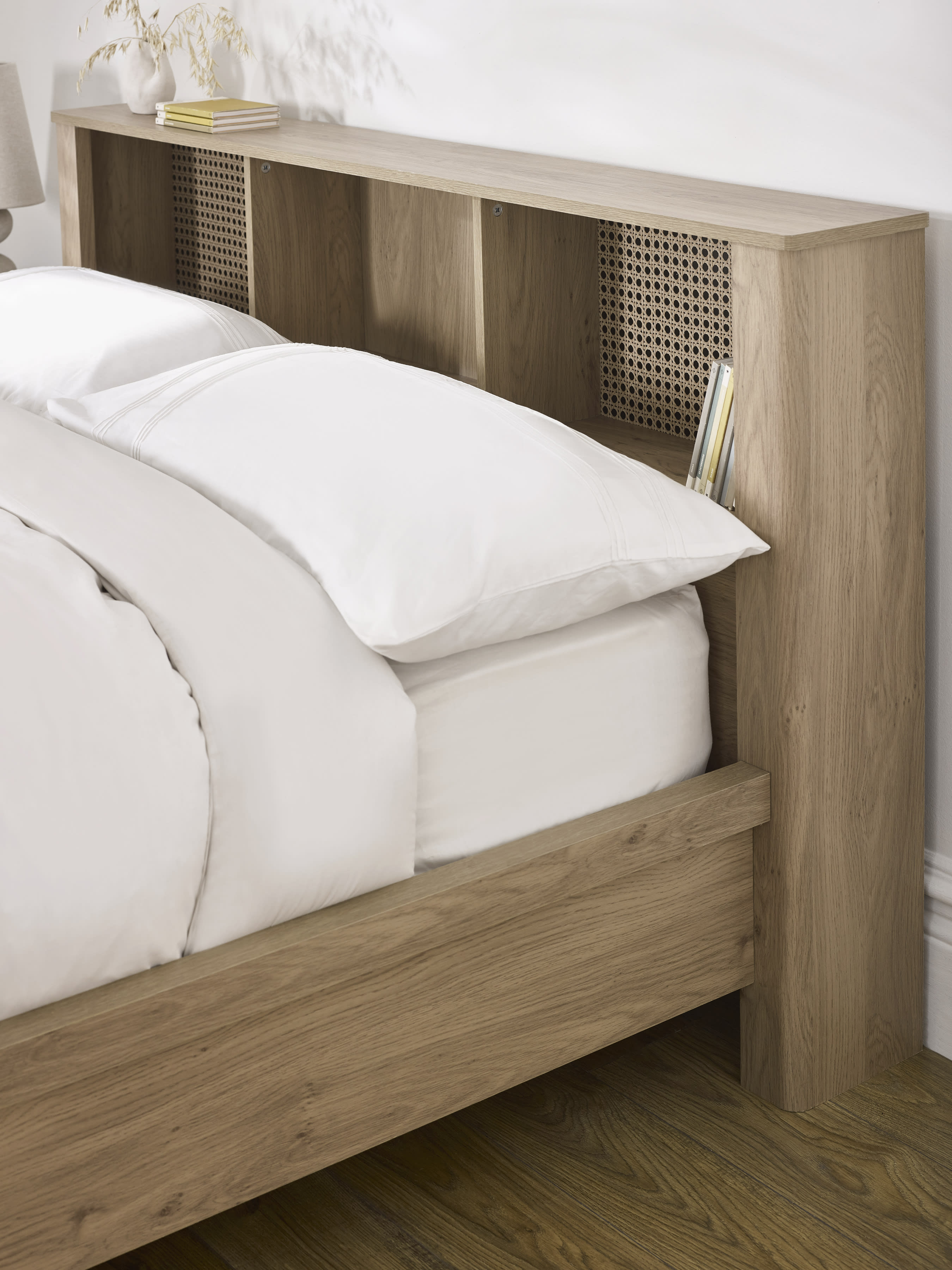 Sydney bed: oak effect bookcase headboard beside the pillows, close up