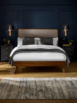 Julian Bowen Walden bed in walnut effect with a grey chenille headboard, in a bedroom