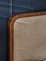 Walden bed: grey chenille headboard and walnut effect frame, close up