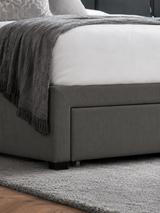 Wilton bed: a dark grey drawer front at the foot of the bed, close up