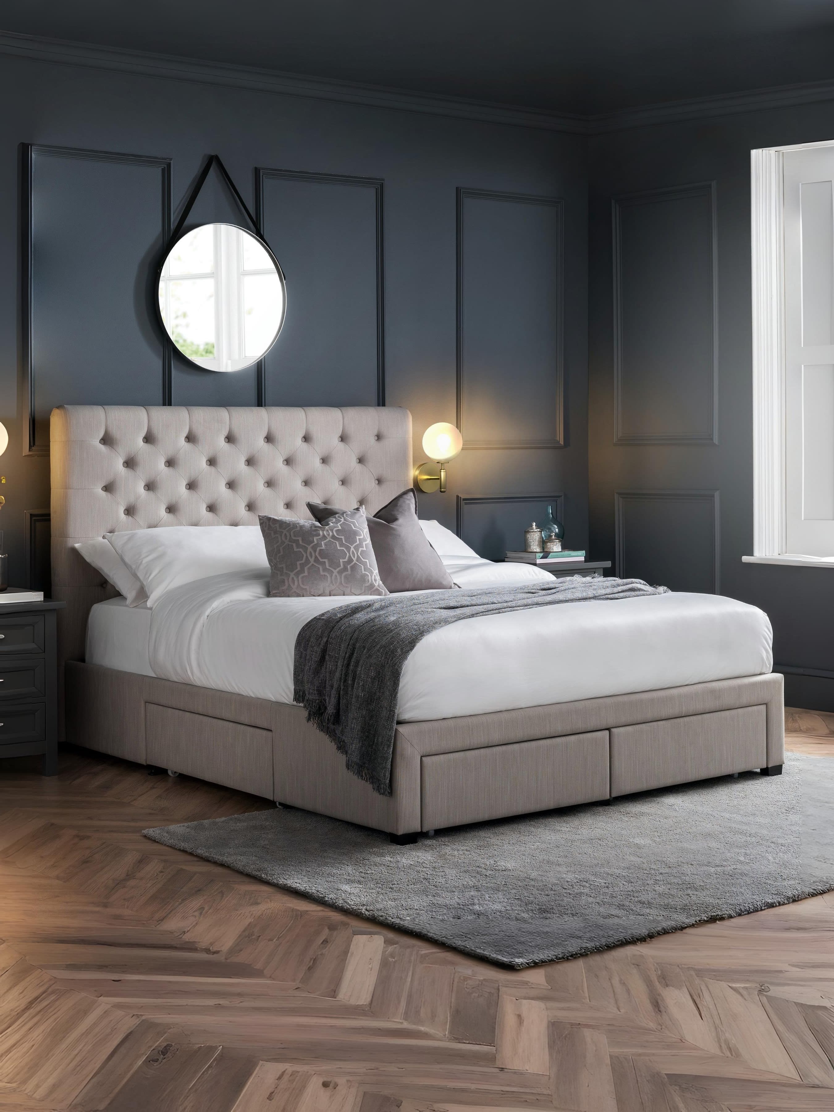 Julian Bowen Wilton light grey bed with a deep buttoned headboard and drawers closed, in a bedroom