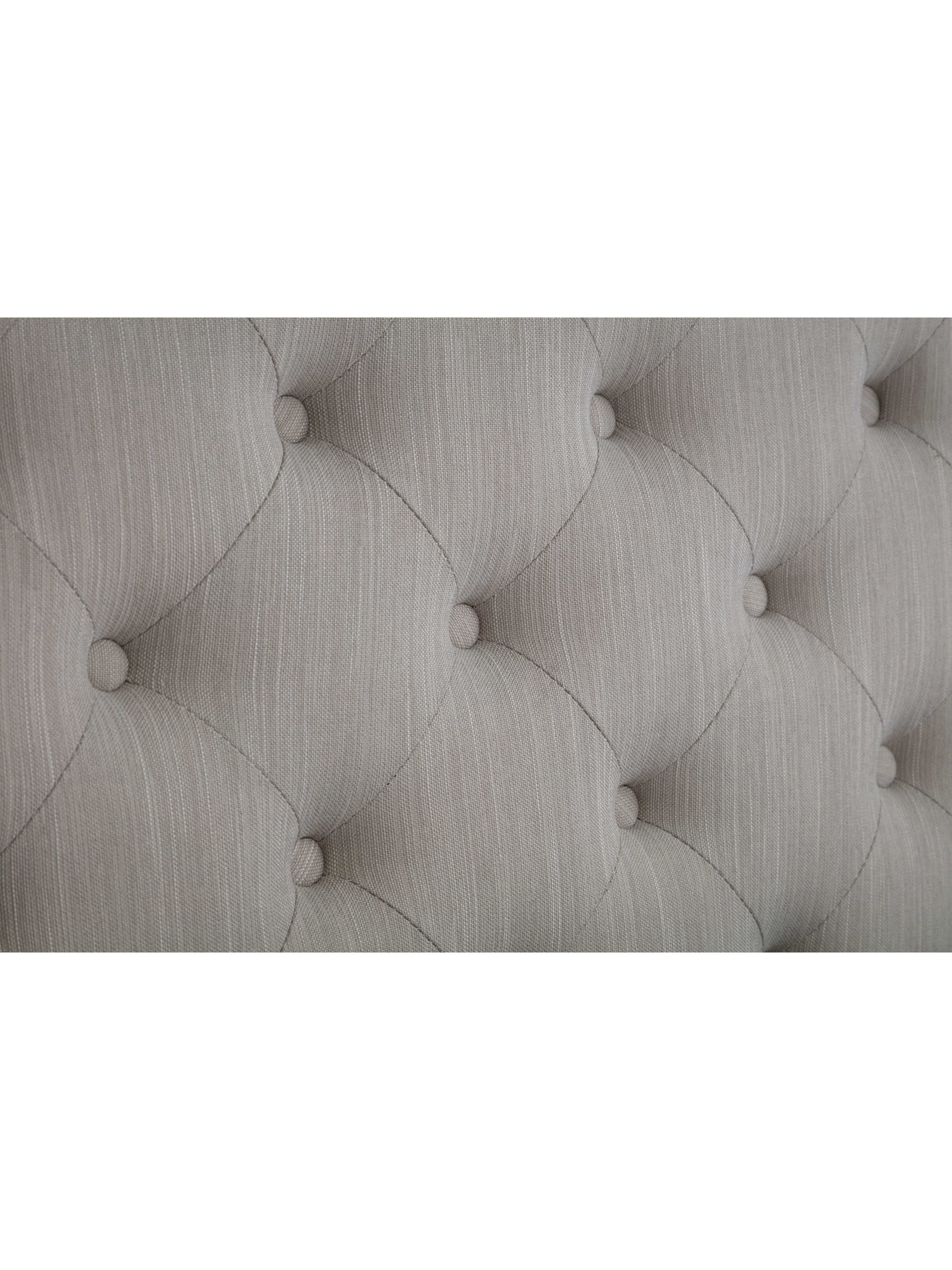 Wilton bed: deep buttoning on the light grey headboard, close up