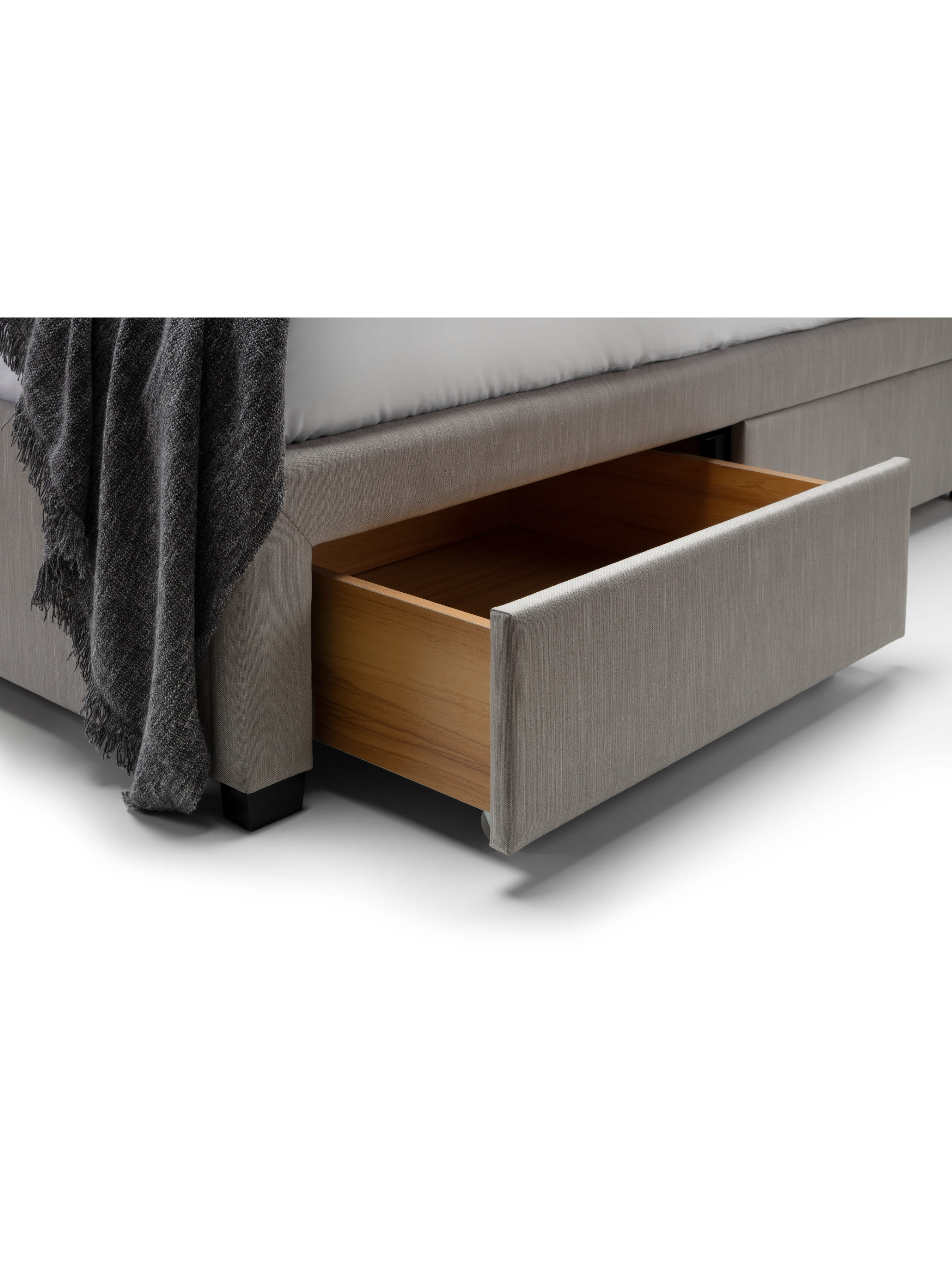 Wilton bed: a drawer pulled out, showing the wood effect inside, close up