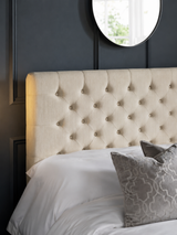 Wilton bed: the oatmeal deep buttoned headboard with pillows, close up