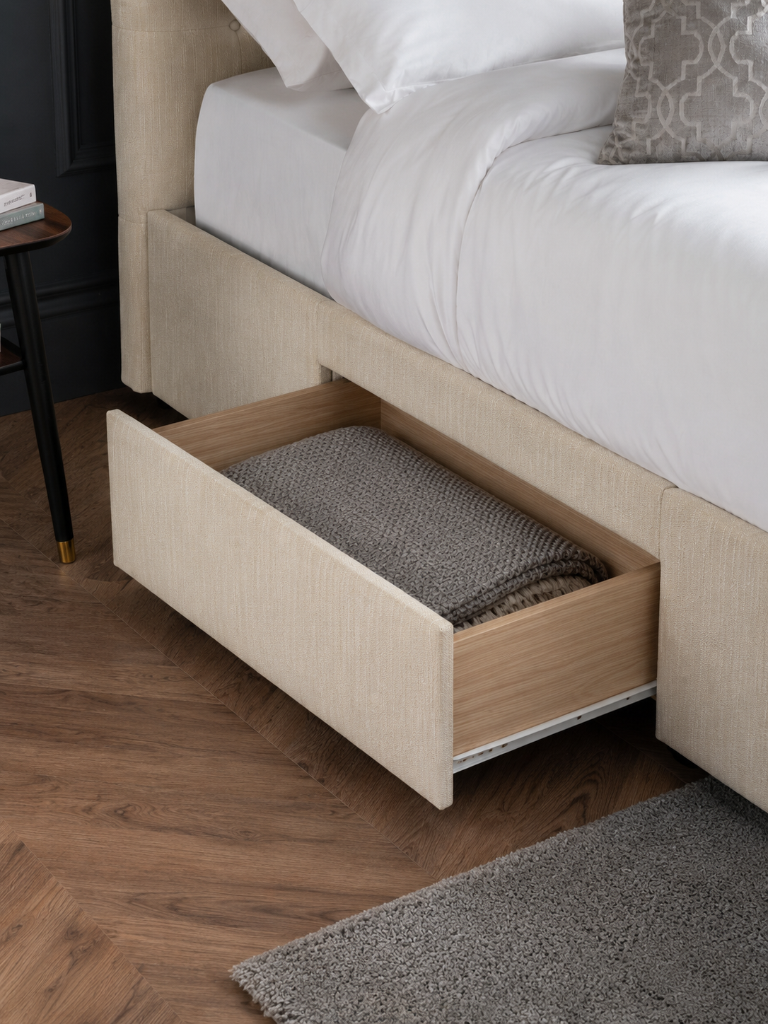 Wilton bed: an oatmeal drawer pulled out with a blanket inside, close up