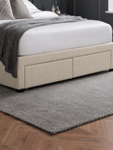 Wilton bed: two oatmeal drawers on the side of the base, close up