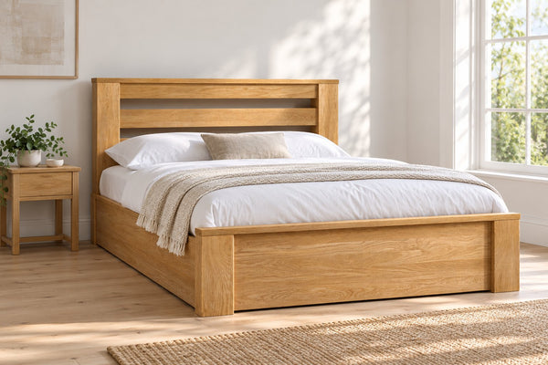 Chiswick solid oak ottoman bed in a natural oak finish, king size, in a bright UK bedroom (bedding for illustration, mattress not included)