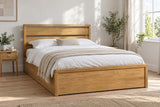 Hampton solid oak ottoman bed in a natural oak finish, king size, in a bright UK bedroom (bedding for illustration, mattress not included)