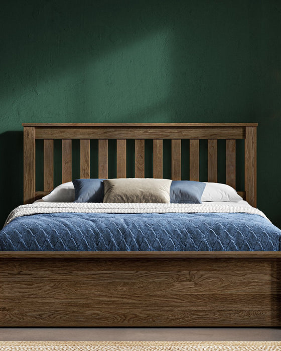 Kingston solid oak ottoman bed, medium oak finish, with the storage closed