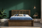 Kingston solid oak ottoman bed, medium oak finish, with the storage closed