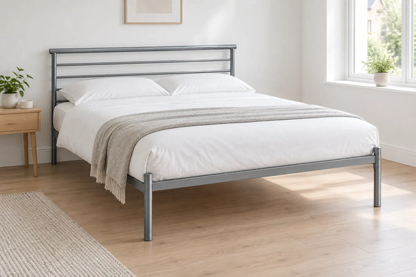 Luca king size metal bed frame in silver with a rail headboard, in a bright UK bedroom