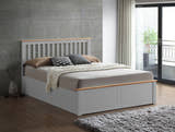 Ruislip wooden ottoman bed in pearl grey, closed, in a bedroom