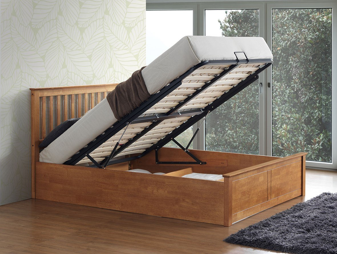 Ruislip wooden ottoman bed in oak, with the gas lift storage open