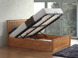 Ruislip wooden ottoman bed in oak, with the gas lift storage open