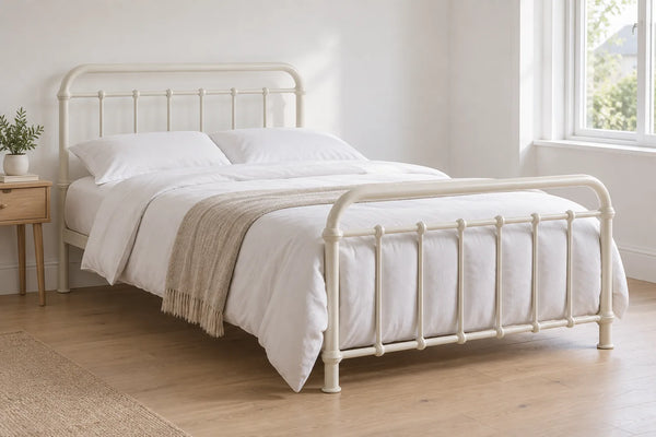 Miami king size metal bed frame in ivory with curved rails, in a bright UK bedroom