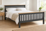 Balham grey and oak wooden bed frame with a high foot end, shown in a bright UK bedroom