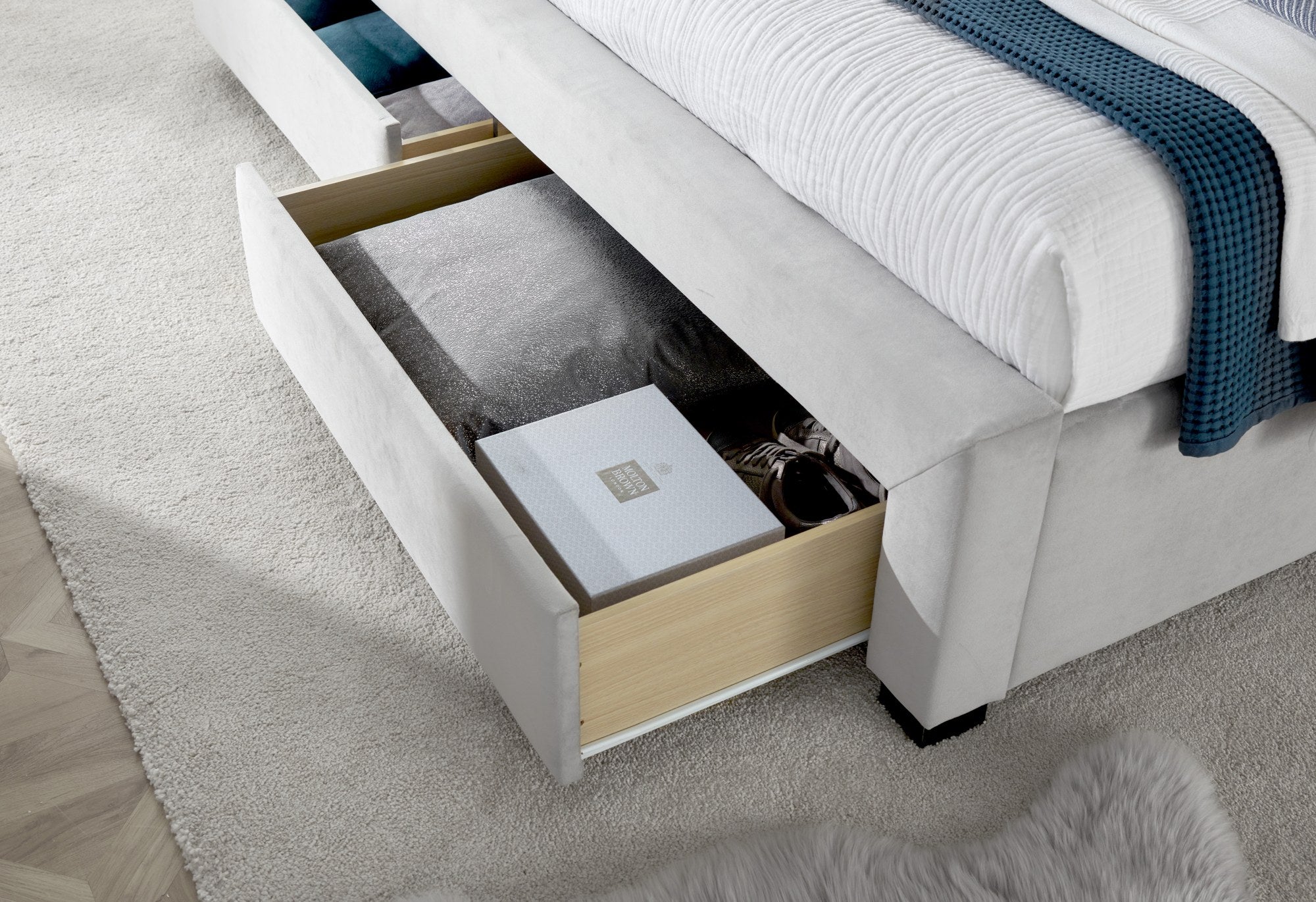 Hendon velvet storage bed in grey velvet, a side drawer open