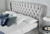Hendon velvet storage bed in grey velvet, close-up of the buttoned winged headboard