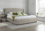 Hendon velvet storage bed in warmstone velvet, with the drawers closed, in a bedroom