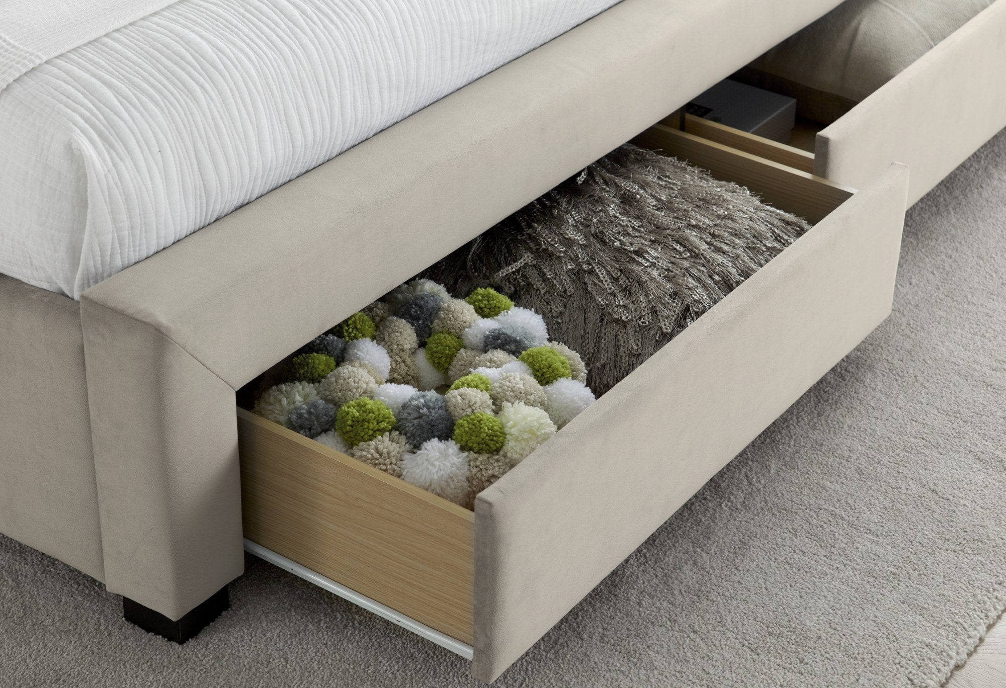 Hendon velvet storage bed in warmstone velvet, a drawer open