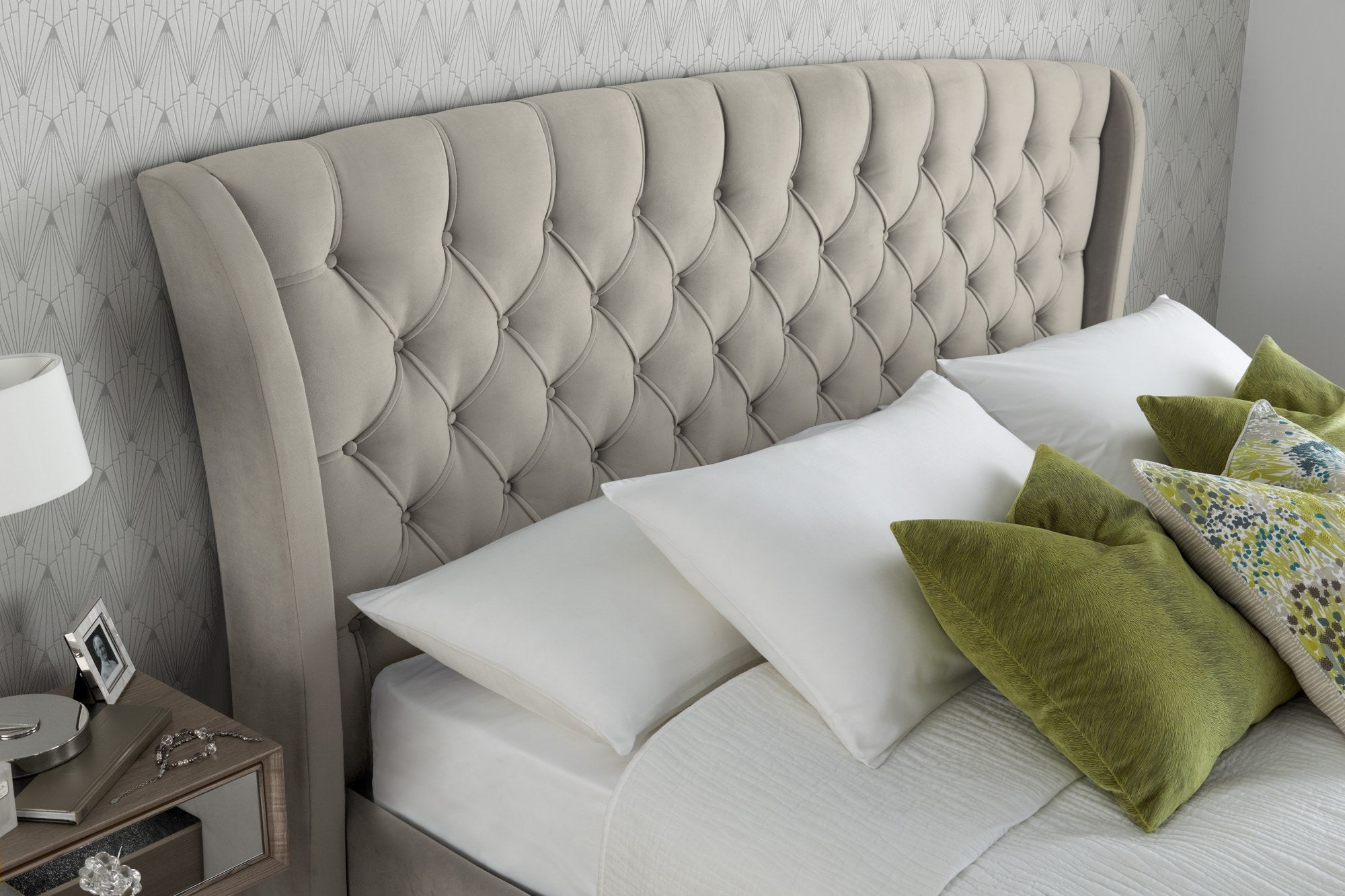 Hendon velvet storage bed in warmstone velvet, close-up of the buttoned winged headboard