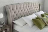 Hendon velvet storage bed in warmstone velvet, close-up of the buttoned winged headboard