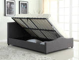 Bexley grey fabric ottoman bed with the base lifted to show the storage