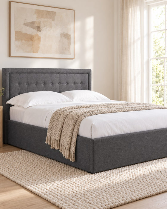 Hammersmith grey fabric ottoman bed with a buttoned headboard, in a bright bedroom (AI-generated illustration of this frame; bedding for illustration, mattress not included)