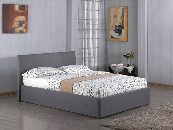 Harlesden grey fabric ottoman bed with the base closed, in a bedroom