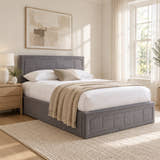 Holland grey velvet ottoman bed with a panelled headboard, in a bright bedroom (AI-generated illustration of this frame; bedding for illustration, mattress not included)