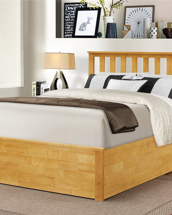 Morden solid rubberwood ottoman bed in oak with the base closed, in a bedroom