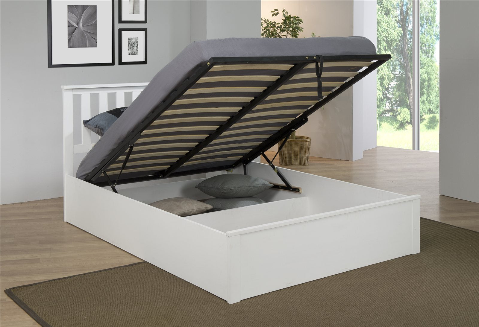 Morden ottoman bed in white with the base lifted to show the storage